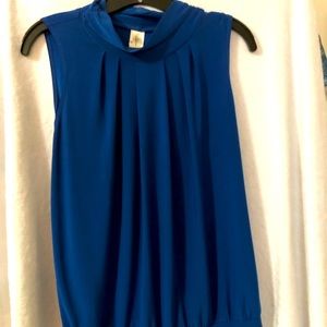 Women’s sleeveless, mock turtleneck